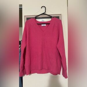 Hot pink long sleeve sweater.